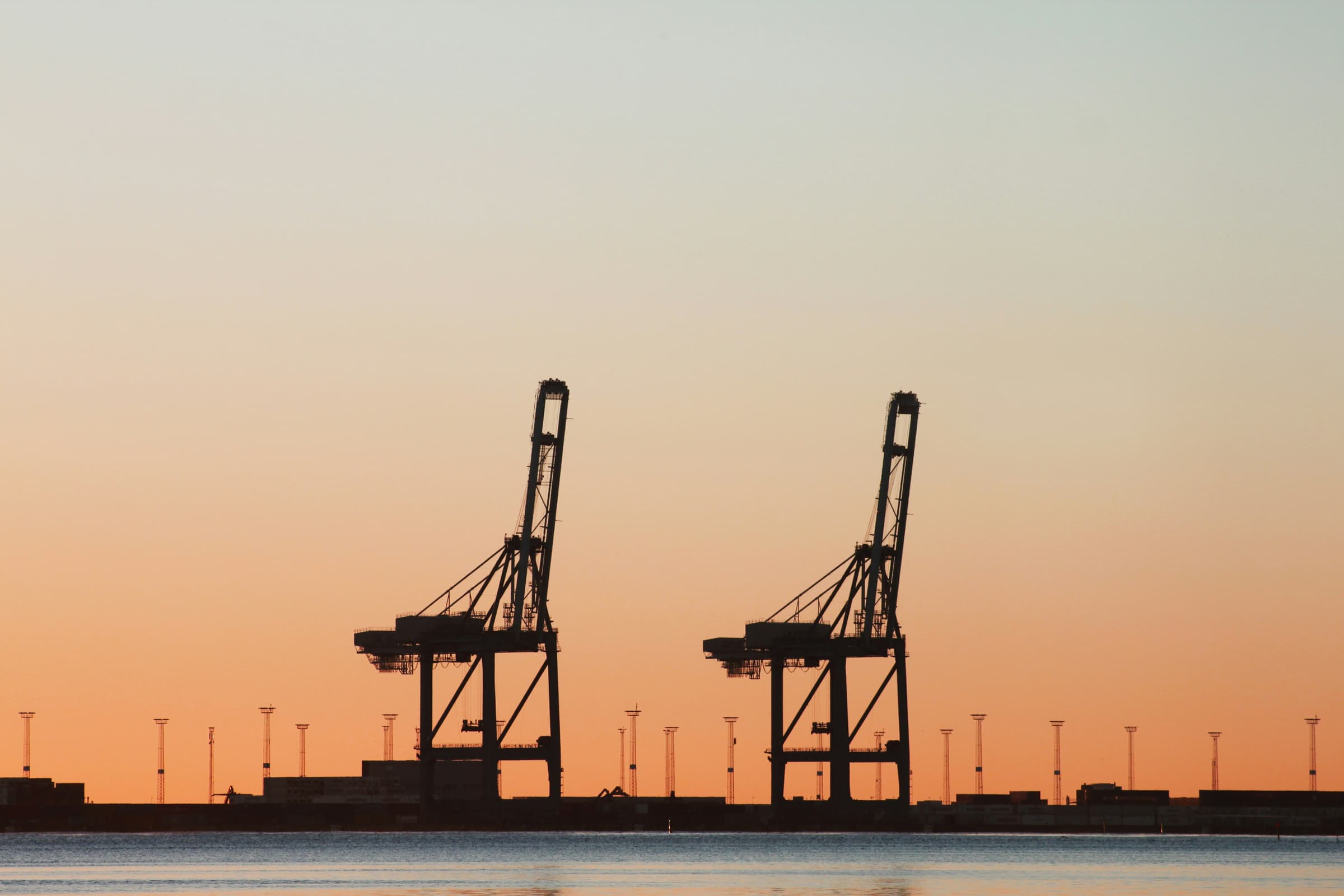 Container gantry cranes at dusk