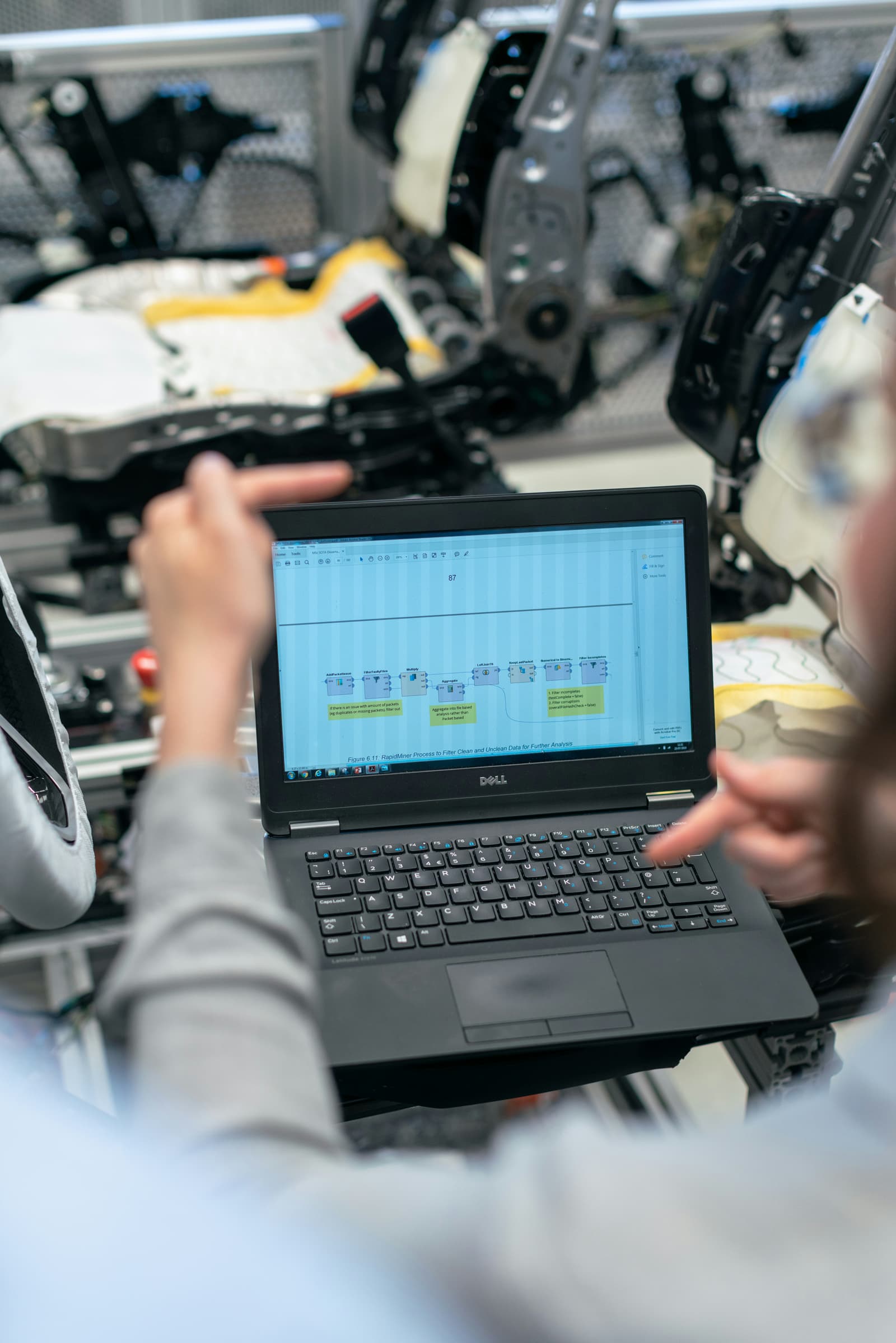 Engineer reviewing process software on the shop floor
