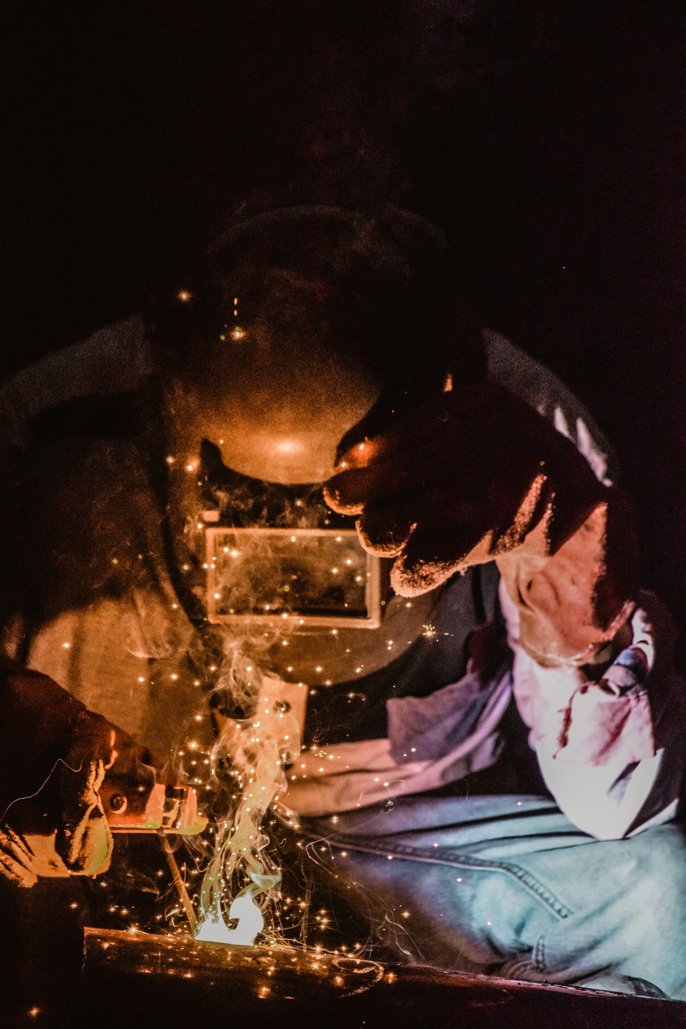 Welder at work amid sparks